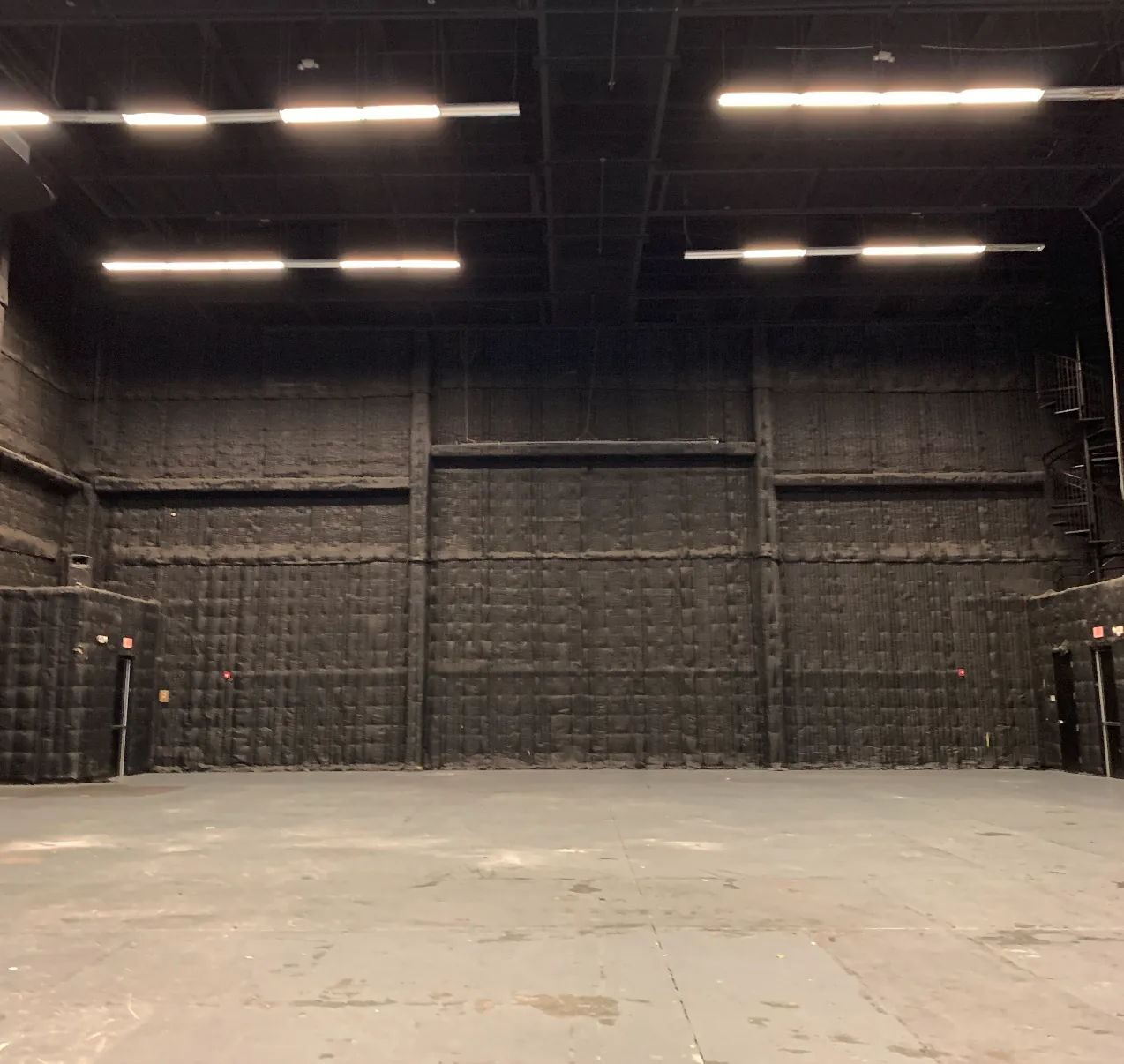 Acoustically treated stage floor and walls